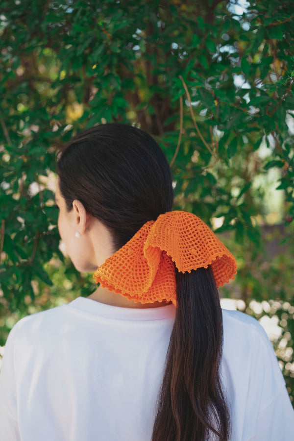 An orange crochet band