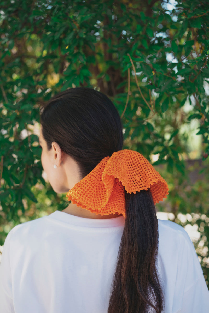 An orange crochet band